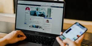 Small business owner creating Instagram promotions on mobile device.